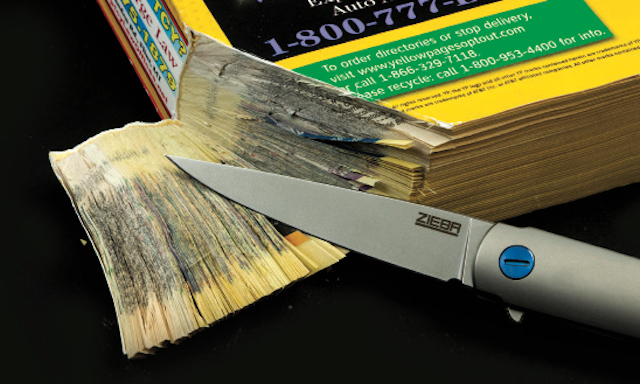 Knife slicing through phonebook