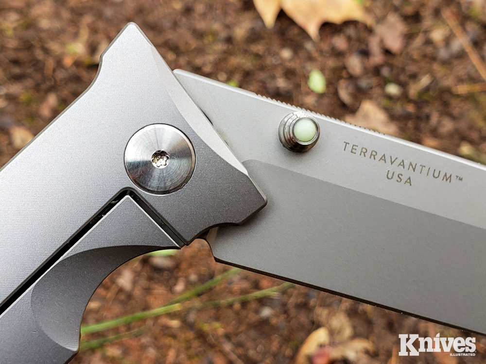 pivot pin and glow-in-the-dark thumb stud of the STS-AT