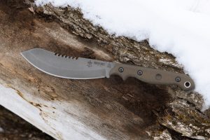 The TOPS Brush Wolf is a short, machete-like chopper with survival knife utility.