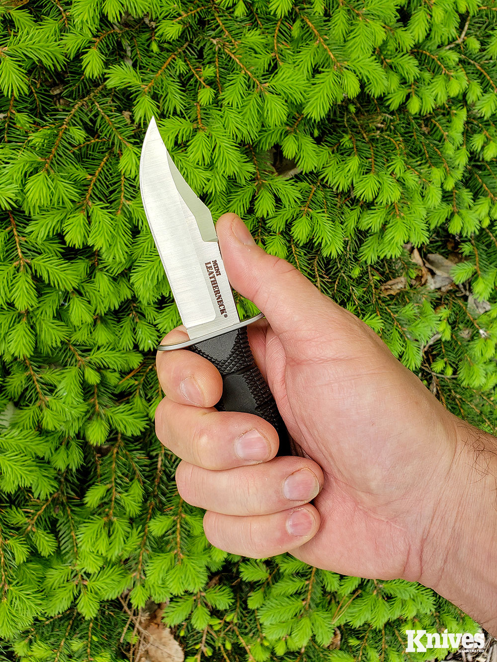 The author can just get four fingers on the grip of the Mini Leatherneck with a little bit of overhang on his pinky finger.