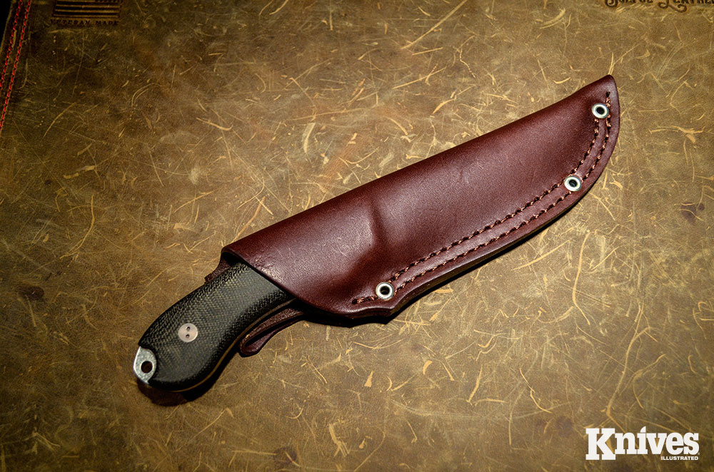 The knife rides deep in the heavy-duty leather sheath. 