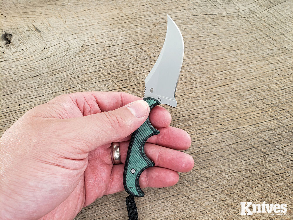 The Persian handles deftly, with scalpel-like precision using a pinch grip.