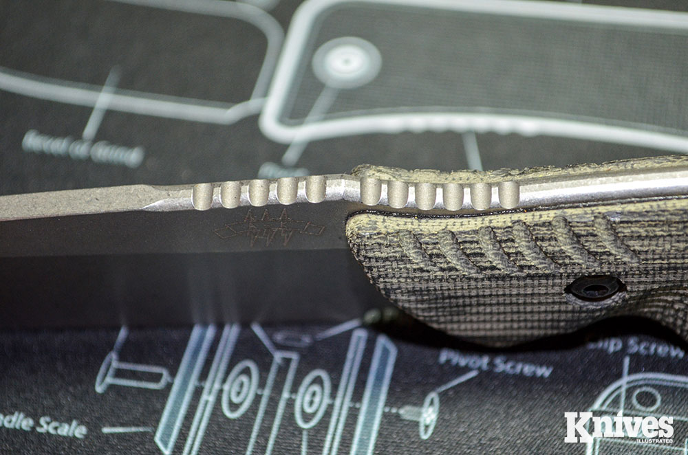 The jimping on the spine bridges the handle to the blade, which works well when you’re choking up on the knife for detail work.
