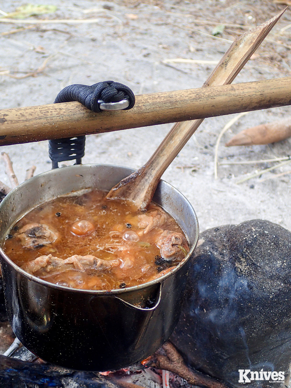 The unique, curved handle of the Uberleben Kessel Bush Pot can be hung over a fire without a pot hanger and without needing to remove the support stick, as would be the case with a bale. This gives it an edge over conventional cook pots.