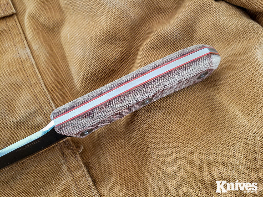 The Mountain Pass knives feature natural Micarta handles with red liners over their full-tang handles.