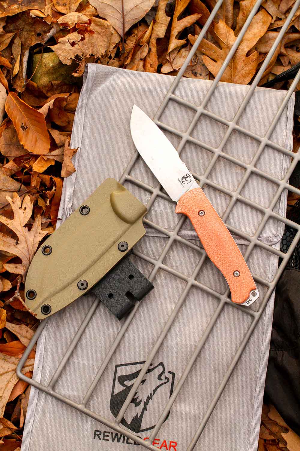 Rewild Gear Gasper 4 Knife with a 4-inch blade and titanium Granite Grill, with canvas sheath.