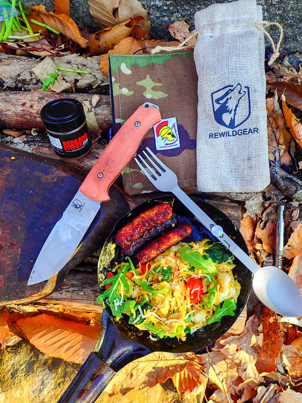 Sausage, egg, tomatoes, arugula, spinach, and cheese scramble prepped with the Gasper 4 knife along with the fire. The Rewild Gear Trailside Utensil was on hand and equipped with a fork, spoon, and bottle opener all in one.