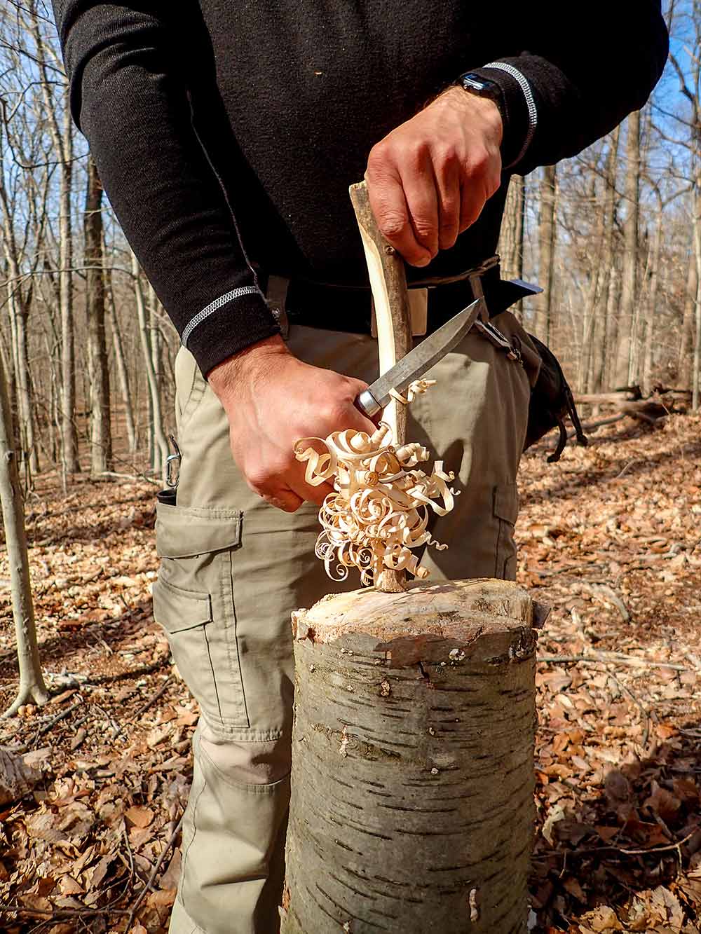 When making a feather stick, start as close to the top as possible and carve down with the tip of the knife pointed slightly upward.