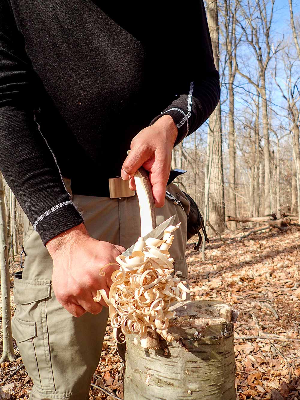 Tilting the knife so the tip points up or down, will produce curly shavings.