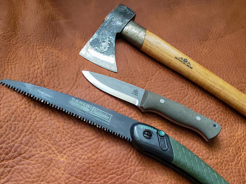 The author created a classic woodsman trio of tools (knife, saw, axe)