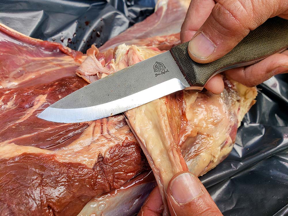 The author used the Orford Trapper to process a deer leg in camp.