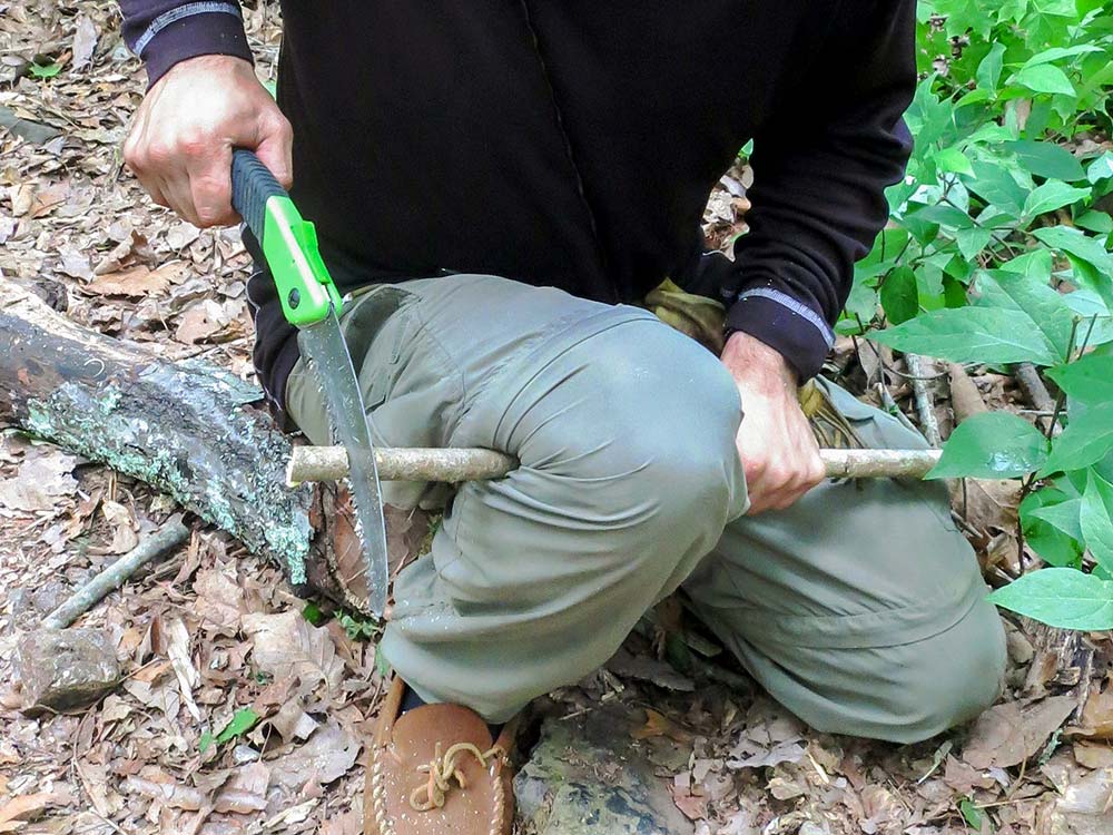 This sawing technique is called a knee-bend cut or plumbers vice. 