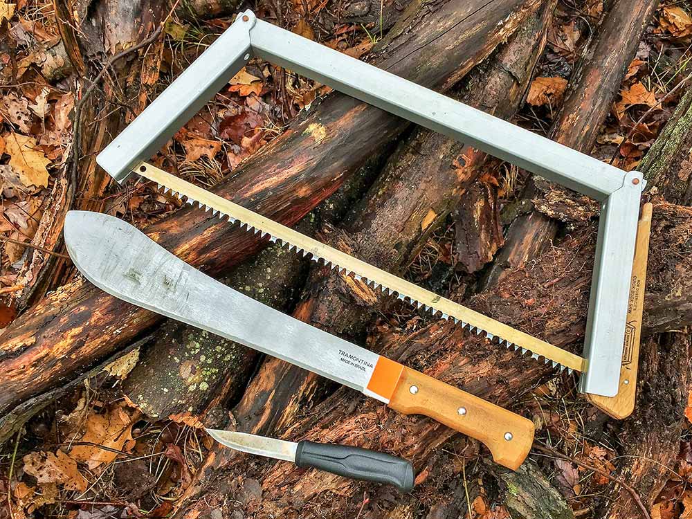 Bob Dustrude Quick Buck Saw along with a Mora 510 sheath knife and 14-inch Tramontina Bolo Machete.