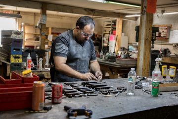 knifemaker in his shop