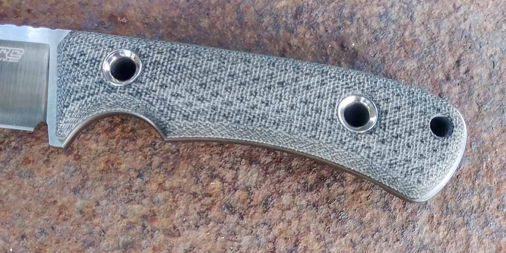 The black canvas Micarta handle