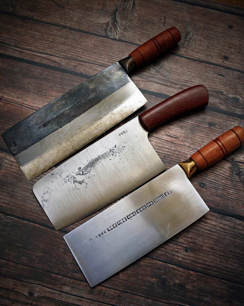 Two Chinese vegetable cleavers surrounding the PB&J Handmade Knives Veggie Cleaver (middle)