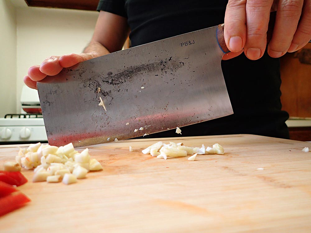 cross-chopping garlic