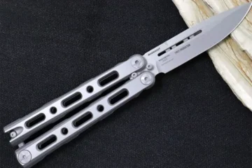 A stainless steel butterfly knife from Benchmade, with a skeletonized handle and drop-point blade.